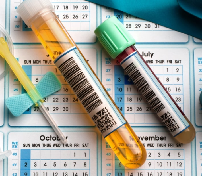 test tubes laying on a calendar